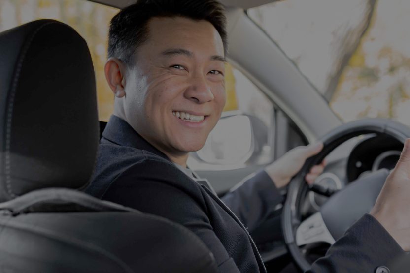 a-man-driving-an-asian-car-behind-the-wheel-looks-2025-03-26-09-47-36-utc_11zon-scaled-870x555